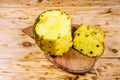 Cutting board with sliced pineapple on wooden table