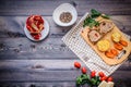 On a cutting board, slices of baked meat, baked potatoes and car