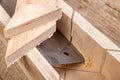 Cutting boards with a handsaw at an angle in the template. Minor carpentry work in the workshop. Royalty Free Stock Photo