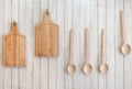 Cutting boards and wooden spoons hanging on the wall Royalty Free Stock Photo