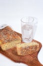 Cutting bread and glass of mineral water