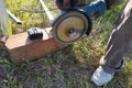 Cutting bricks with an angle grinder, construction work, the process of execution close-up