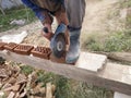 Cutting bricks with an angle grinder in a rural yard Royalty Free Stock Photo