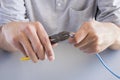 Cutting cable with pliers Royalty Free Stock Photo