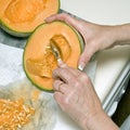 Cutting cantaloupe sequence 3 Royalty Free Stock Photo