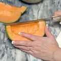 Cutting cantaloupe sequence 4 Royalty Free Stock Photo