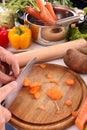 Cutting carrots Royalty Free Stock Photo