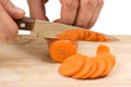 Cutting carrots on the board Royalty Free Stock Photo