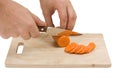 Cutting carrots on the board Royalty Free Stock Photo