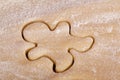Cutting cookies dough gingerbread man shape