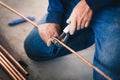 Cutting copper pipe air conditioner Royalty Free Stock Photo