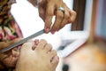 Cutting cuticle during manicure procedure in the beauty salon.Nail cleaning in the beauty salon.