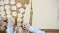 Cutting Dough into circles, top view. Scene. Preparation Meat Dumplings. Roll out the dough and cut circles out of it