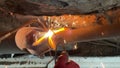 Cutting the exhaust with the oxygen source while wearing red gloves