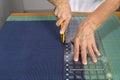 Cutting fabric for use in a quilt.