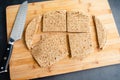 Cutting Whole Grain Flatbreads into Squares Royalty Free Stock Photo