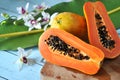 Cutting Fresh Papaya on Wooden Board Royalty Free Stock Photo