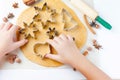 Cutting the gingerbread cookie dough for Christmas and New Year Royalty Free Stock Photo