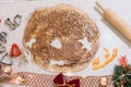 Cutting the gingerbread cookie dough to make tasty biscuits for Christmas and New Year`s Eve, closeup Royalty Free Stock Photo