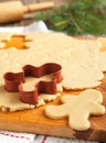 Cutting gingerbread cookies dough homemade for Christmas