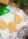 Cutting gingerbread cookies dough homemade for Christmas.