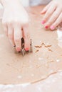 Cutting gingerbread shapes from dough Royalty Free Stock Photo