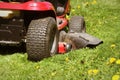 Cutting the grass of on a tractor lawn mower Royalty Free Stock Photo