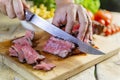 Beef steak cut on chopping board Royalty Free Stock Photo