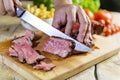 Beef steak cut on chopping board Royalty Free Stock Photo