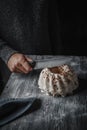 Cutting a gugelhupf cake covered with a vanilla frosting Royalty Free Stock Photo