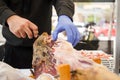 Cutting ham with gloves Royalty Free Stock Photo