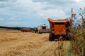 Cutting hay the combine on field  in the summertime Royalty Free Stock Photo