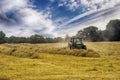 Cutting hay the tractor Royalty Free Stock Photo