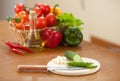 Cutting healthy food fresh cucumber on hardboard Royalty Free Stock Photo