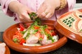 Cutting herbs in a tajine