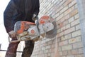 Cutting a hole in the wall using a cutter Royalty Free Stock Photo