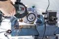 Cutting the hub with a circular electric saw on the vice.