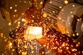 Cutting industrial metal with grinder. Sparks while grinding iron Royalty Free Stock Photo