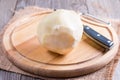 Cutting a kohlrabi on a wooden table Royalty Free Stock Photo
