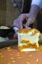 Cutting Kunafa or Kinafa, Arabic Sweets with Cheese for Ramadan a