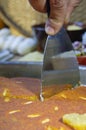 Cutting Kunafa or Kinafa, Arabic Sweets with Cheese for Ramadan a