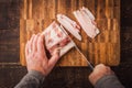 Cutting lard on the wooden board top view