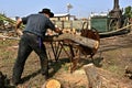 Cutting logs on a steam powered saw Royalty Free Stock Photo