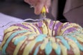 Cutting Into a Mardi Gras King Cake