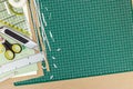 Cutting mat with various office supplies and tools, top view Royalty Free Stock Photo