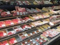 Cutting meat in refrigerator for sale at store USA