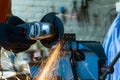 Cutting metal with an angle grinder. Metal particles flying Royalty Free Stock Photo