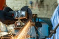 Cutting metal with an angle grinder. Metal particles flying Royalty Free Stock Photo