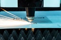 Cutting of metal  sparks fly from laser Royalty Free Stock Photo
