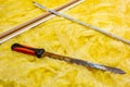 Cutting mineral wool for house insulation